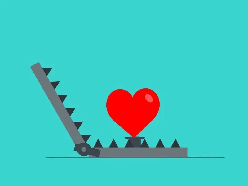 Illustration: rotes Herz in einer Falle